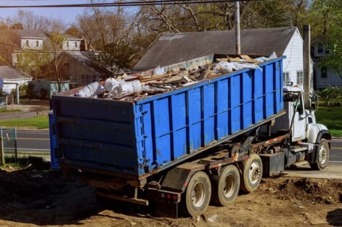 Dump truck with junk inside of it